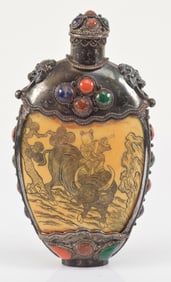 Mongol style snuff bottle. China. 19th century. Carved engraved panels set in silver with cabochons