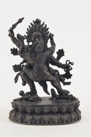 Bronze tantric buddhist image. Tibet. 19th century. Figure of Mahakala in yab yum. Seated on a