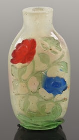 Cameo glass snuff bottle. China. 19th century. 5 color overlay carved with flowers. 2.25in.