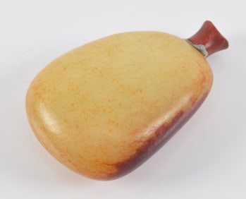 Jade pebble snuff bottle. 18th century. China. Yellow stone with russet markings. 2.25in.