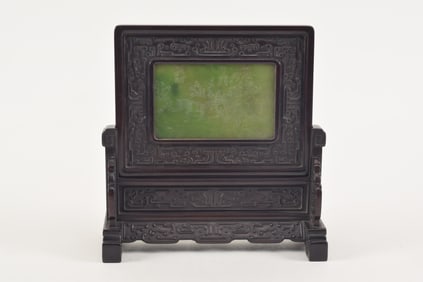 Jade ink screen. China. 18th century. Central jade plaque engraved and gilded with a landscape with