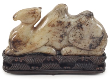 Jade camel. China. 19th century. Greystone with black markings. 5.5 x 3in. Fitted stand.