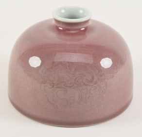 Porcelain water coupe. China. 19th century. Beehive form. Peach bloom glaze with engraved dragon