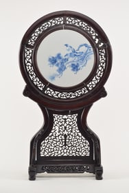 Circular porcelain plaque. China. Early 20th century. Underglaze blue decoration of a hawk in a pine