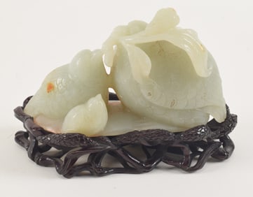 Jade carving. China. 18th/19th century. "Quail and millet" design. Lychee white color. Finely carved