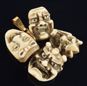 Carved toggle. Japan. 19th century. Netsuke group of 4 masks. signed. Gold mounts. 2 x 2in.