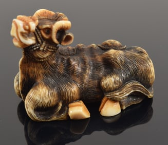 Carved netsuke. Japan. 19th century. Study of a ram. Signed Masanao. 1959 bill of sale.