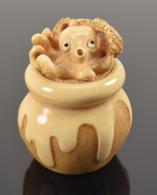 Carved netsuke. Japan. 19th century. Octopus in a pot with crabs. 1.25in. 1960 bill of sale.