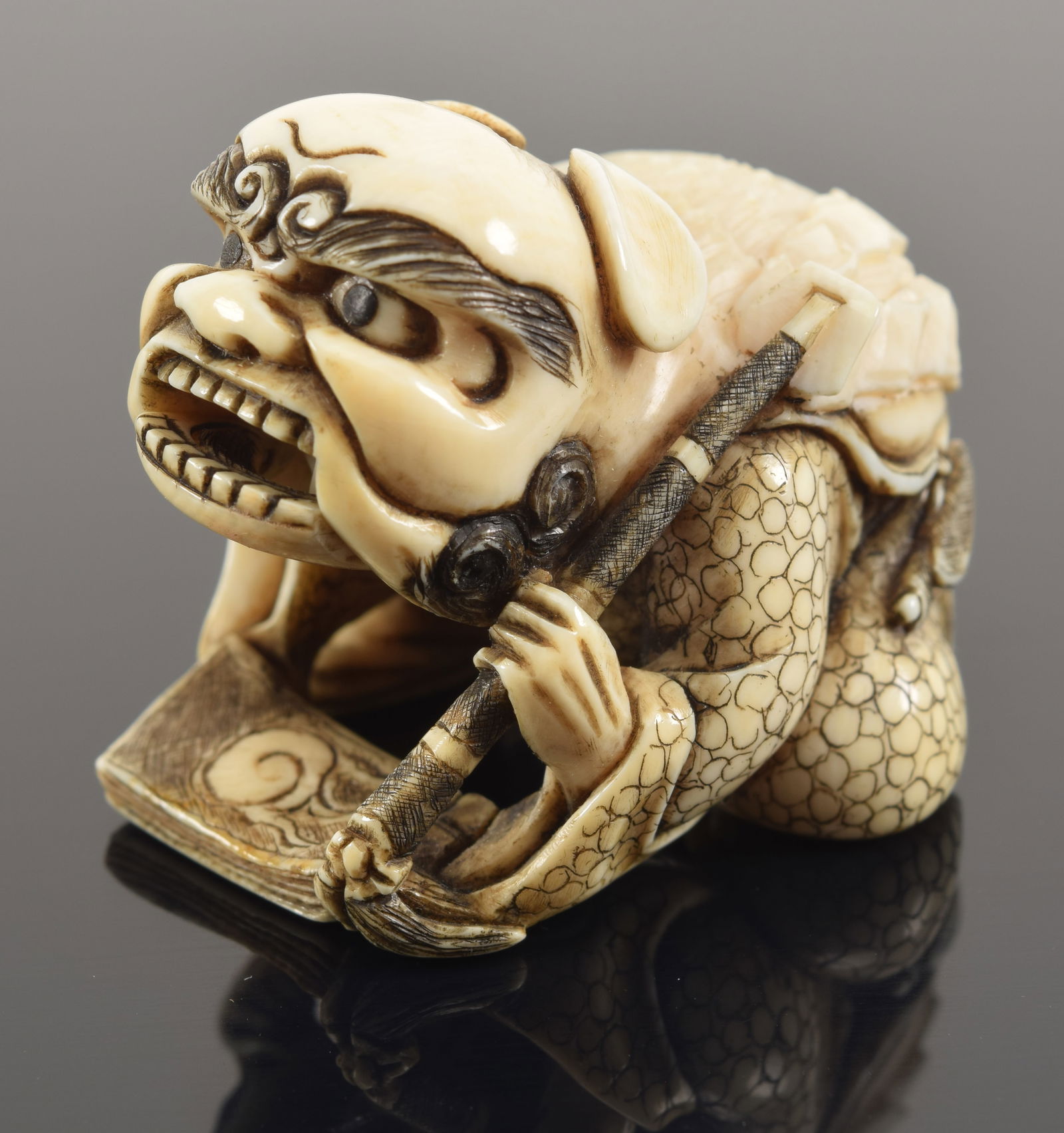 Carved netsuke of shishi mask dancer. Japan. 19th century. 1.75in signed. (1 of 8)