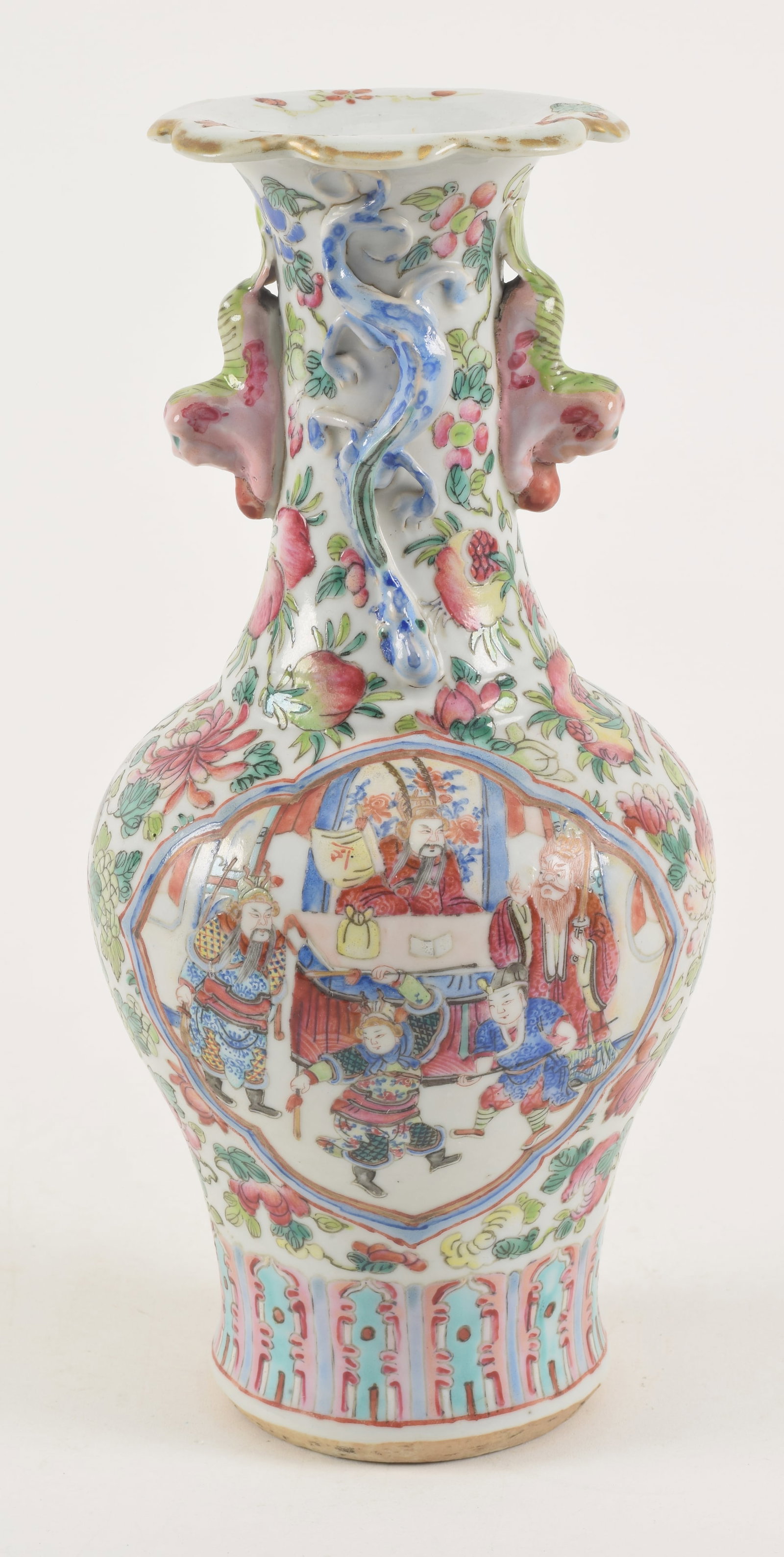 Porcelain vase. China. Mid 19th century. Famille rose historical scenes on a flowered ground. shaped: Porcelain vase. China. Mid 19th century. Famille rose historical scenes on a flowered ground. Shaped mouth, foo dog handles. 9.5in. Minor old glaze chips to dragons.