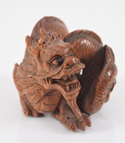 Carved wooden netsuke of a dragon. Japan. Early 20th century. 1.5in.