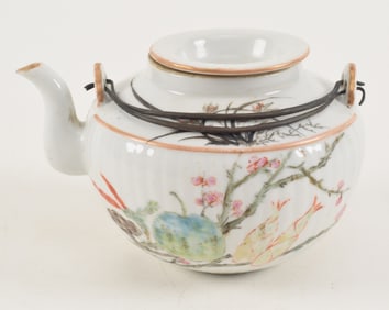 Porcelain wine ewer. China. 19th century. Famille rose decoration of flowers with inscriptions. Hall