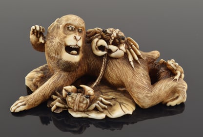Cabinet carving. Japan. Meiji period (1868-1912). Scene of a monkey with a frog and two crabs.