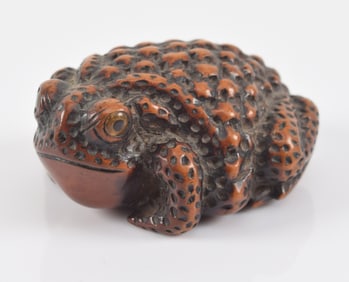Carved toggle. Japan. 18th century. Netsuke study of a frog. Signed.