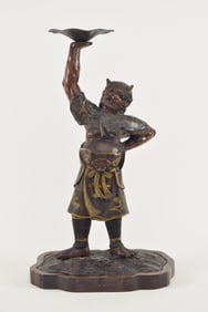 Bronze sculpture of a Oni demon. Japan. Meiji period (1868-1912). Carved fitted wooden stand. 21in
