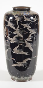 Cloisonne vase. Japan. Meiji period (1868-1912). Cranes on a black ground. Damage spot near top.
