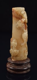 Jade tube. China. Ming period (1368-1644). Stone with russet markings. Carved with ling chih. 2.5in