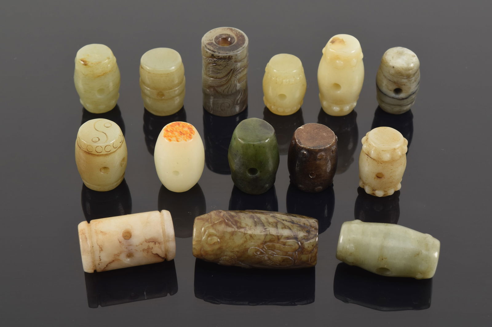 Lot of 13 jade beads. China. Each about 1in length. (1 of 6)