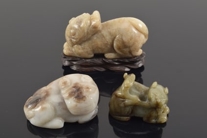 3 jade animals. China. 19th century. One highly translucent with black markings. Each about 4in
