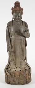 Carved wooden standing image of the goddess of mercy Kuan Yin. China. Probably Ming period, 17th