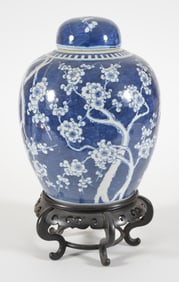 Porcelain covered jar. China. 19th/early 20th century. Ovoid shape with a flowering prunus in