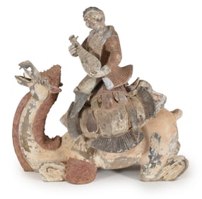 Tomb figure. China. Possibly Tang period. Musician riding a camel. 23.5in long. Traces of