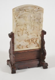 Table screen. China. Early 20th century. Marble plaque carved with women viewing lotus flowers.
