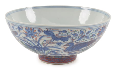 Porcelain bowl. China. 19th century. Wu tsai ware. Decoration of ducks and aquatic plants, dragon on
