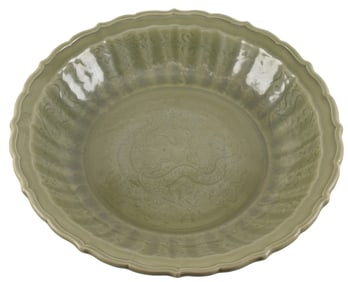 Celadon charger. China. Ming period (1368-1644). Lung Chuan ware. Foliated edge. Sgraffito and