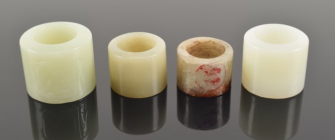Lot of 4 jade archers rings. China.