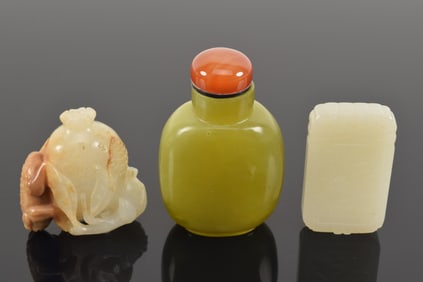 Lot of 3 jades. China. 19th century. To include: a yellow jade snuff bottle, a white rectangular
