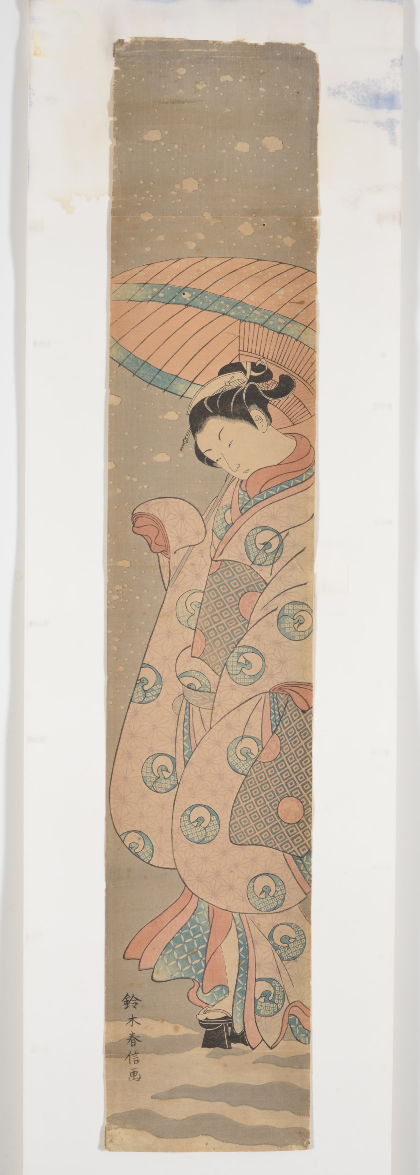 Woodblock print. Figure of a woman with a parasol. Signed Harunobu. 27 x 5in. (1 of 4)
