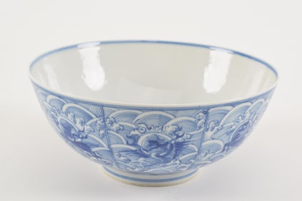 Porcelain bowl. China. 20th century. Underglaze blue decoration of mythical animals on a wave