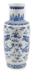 Porcelain vase. China. 19th/early 20th century. Rouleau form. Underglaze blue decoration of dragons
