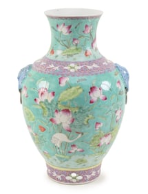 Porcelain vase. China. Early 20th century. Decoration of birds and lotus on a turquoise ground.