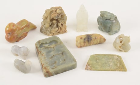 10 jade carvings. China. 20th century. To include: an inkstone, 5 animals, and others. Largest