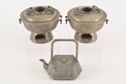 3 Chinese works. 19th century. A pewter wine pot and 2 paktong chafing dishes.