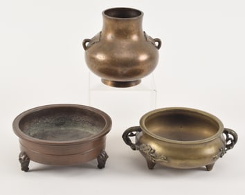 3 bronzes. China. 19th century. To include: 2 censers and a silver inlaid vase. 7in, 8in, and 5.5in.