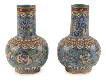 Pair of cloisonne vases. China. 18th century. Bottle form. Decoration of flowers on a turquoise