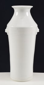 Porcelain vase. China. 19th century. Cylindrical with lion mask handles. Te Hua ware. 11in.