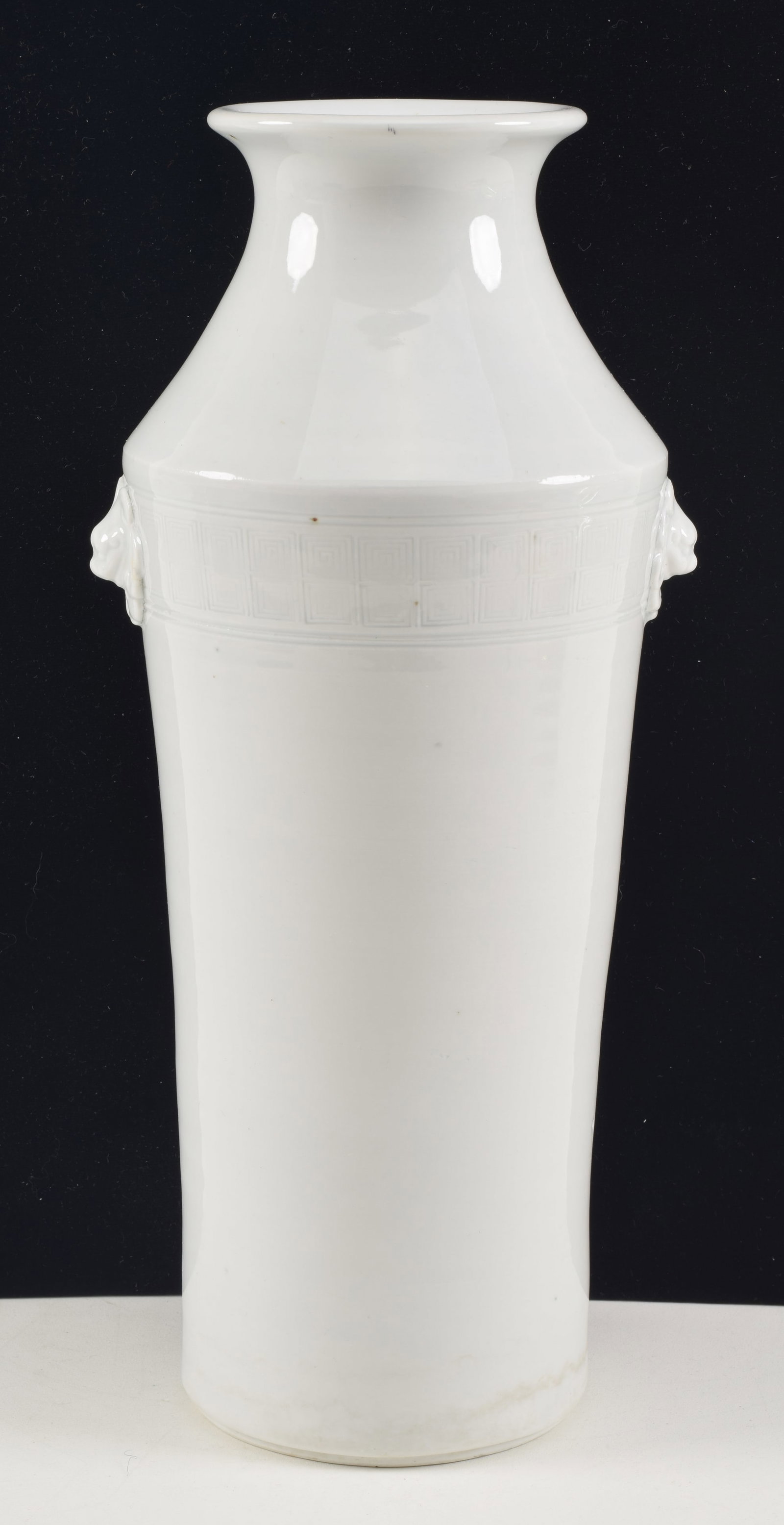 Porcelain vase. China. 19th century. Cylindrical with lion mask handles. Te Hua ware. 11in.: Porcelain vase. China. 19th century. Cylindrical with lion mask handles. Te Hua ware. 11in.