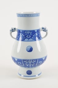 Porcelain vase. China. 18th century. Pear shaped with animal head handles. Underglaze blue archaic
