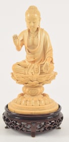 Carved image of the buddha. China. 19th century. Figure of Amida seated on a lotus throne. 8.5in