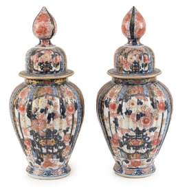 Pair of porcelain covered jars. Japan. 19th century. Imari ware. Ribbed bodies. Honorific mark on