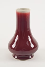Porcelain vase. China. 20th century. Lang yao red glaze fading to white at the mouth. Repair to