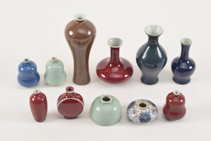 Lot of 11 porcelain small vases. China. 18th-20th centuries. Mostly monochromes. Largest about 7in.