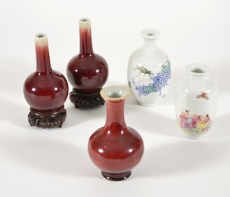 Lot of 5 vases. China. Early 20th century. 3 oxbloods and two with enameled decoration. Each about