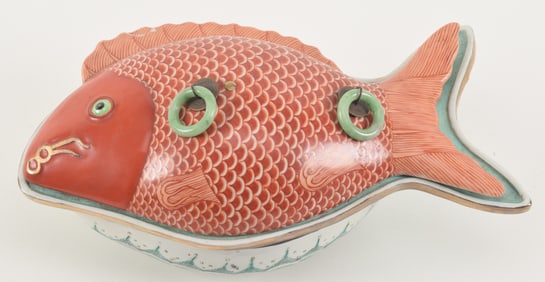 Porcelain fish service dish. China. 20th century. Top in the form of an iron red carp. Jade handles.