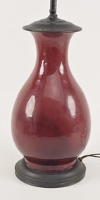 Lang yao oxblood vase. China. 19th century. Pear shaped with a deep red glaze. Drilled and mounted