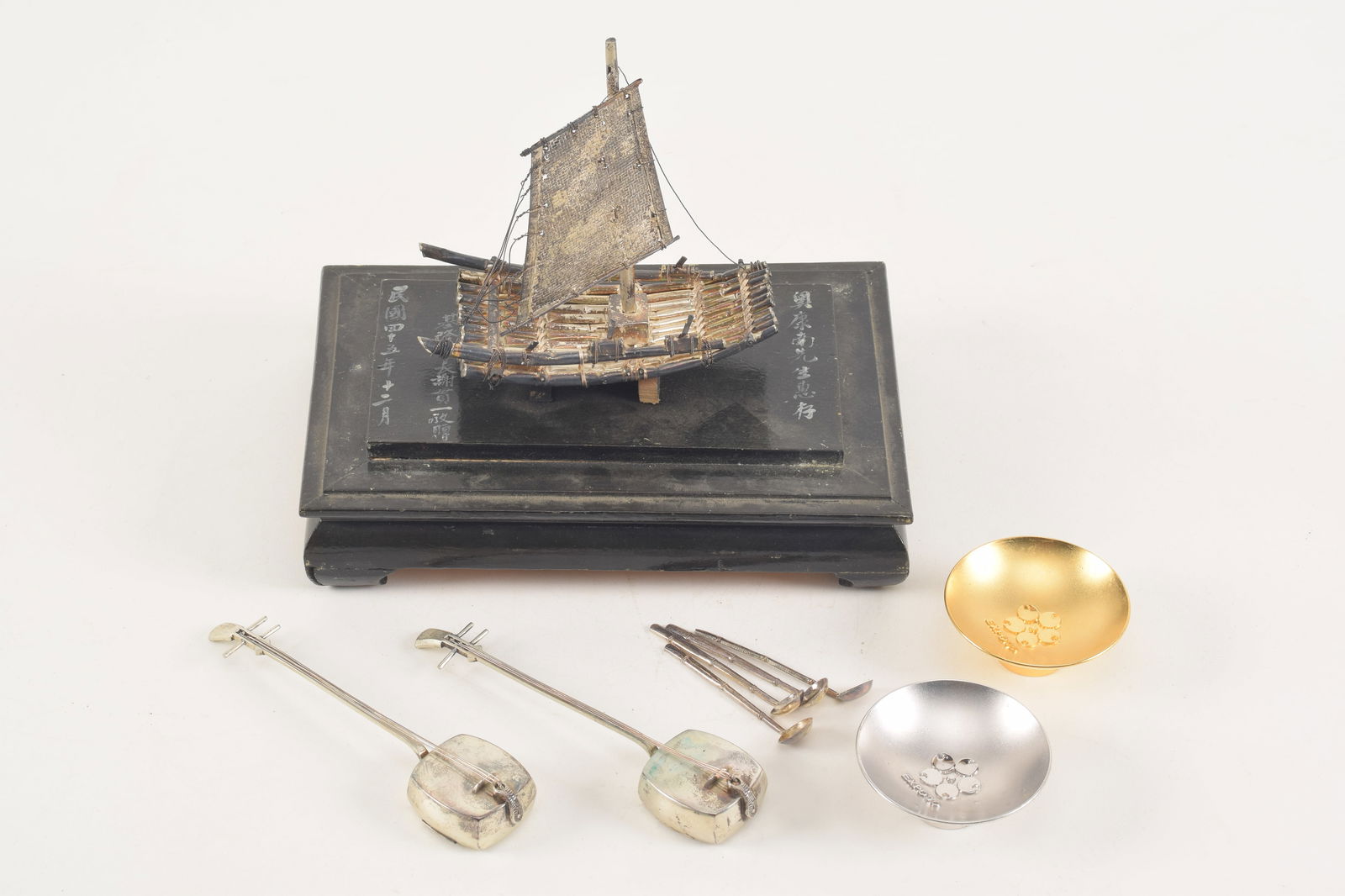 Lot of silver miniatures. China and Japan. Early 20th century. To include: a sailing junk and (1 of 6)